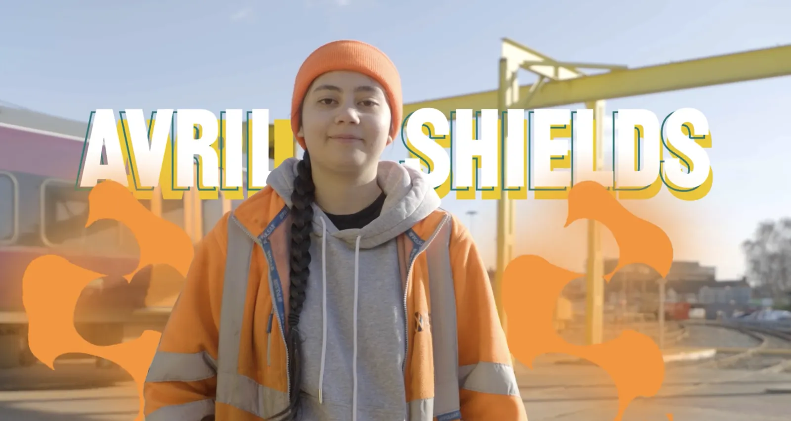 GBSIoT programme film still: an apprentice in hi-vis beside rail engineering works