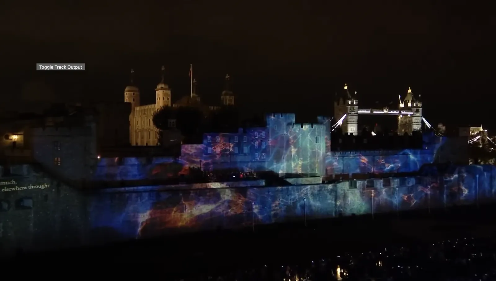 Projection mapping illuminating the Tower of London walls at night